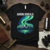 Black t-shirt with "AURORA BOREALIS" text above a graphic of the northern lights over mountains and a lake