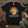 Kangaroo family with joey in pouch, text "AUSTRALIAN FAMILY ADVENTURE OUTBACK EXPLORERS SINCE FOREVER" on black t-shirt, vintage sunset graphic