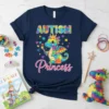 Autism Princess T-Shirt featuring a colorful puzzle dragon wearing a crown and holding a wand, with "Autism Princess" text
