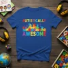 Autistically Awesome text on a blue t-shirt with colorful puzzle piece cityscape graphic, autism awareness design