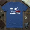 Blue t-shirt with bold white text "AVIATOR AVIATOR" and graphics of a parachute, globe, and jet