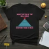 T-shirt with pink text "AVOID THE TOP OF THE BELL CURVE" above a blue bell curve graphic with a red