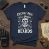 Awesome Dads Have Tattoos AND BEARDS quote on a navy blue t-shirt with a skull graphic