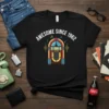 Awesome Since 1962 text with a retro jukebox graphic on a black t-shirt