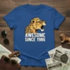 Awesome Since 1986 t-shirt with a roaring cheetah wearing leopard print sunglasses. Bold white text reads "AWESOME SINCE 1986"