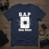 Navy blue t-shirt with white text "B.A.P One Shot" and a graphic of a cracked surface with a bullet hole