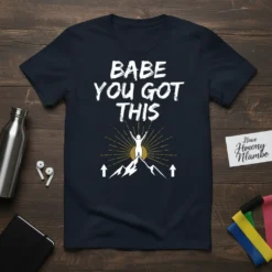 Inspirational Babe You Got This quote on a navy t-shirt with a graphic of a woman on a mountain summit