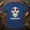 Geometric baboon skull design with red glowing eyes and text "BABOON SKULL PRIMATE ANATOMY" on a navy blue t-shirt