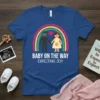 Baby on the way expecting joy text with pregnant couple and rainbow graphic on blue t-shirt