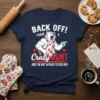 Back Off! I Have A Crazy Aunt design featuring a bear in an apron and bold text, on a navy