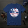 Blue t-shirt with "BACK THE BLUE" text in white and red, featuring American flag design and police badges