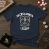 Backgammon Legend t-shirt design featuring a shield with dice, checkers, and a crown, with bold text
