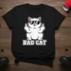 Black t-shirt with "Bad Cat" text and a white cat wearing sunglasses giving the middle finger