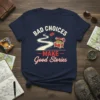 Bad Choices Make Good Stories quote t-shirt design featuring a winding road, treasure chest, and open book graphic