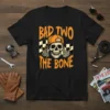 Bad Two The Bone skull graphic t-shirt with orange text and checkered flags, featuring a skeleton wearing a cap