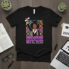 BAE Black And Educated graduation t-shirt with a woman in cap and gown holding a diploma, featuring colorful geometric background