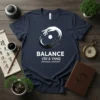 Balance Yin & Yang Universal Harmony text with circular hand symbol on a navy blue t-shirt