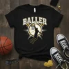 Black t-shirt with "Baller" text above a silhouette of a basketball player dunking into a hoop, gold and white accents
