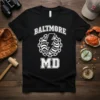 Black t-shirt with white "BALTIMORE MD" text and a central lightning bolt graphic within a circular chain design