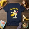 Banana Crew Est. 2023 design featuring a peeled banana character with its tongue out, yellow text, and "Crew Est. 2023"