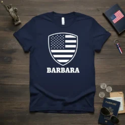 Navy t-shirt with white BARBARA text below a white shield featuring the American flag design