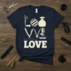 Barber Love graphic tee with scissors, combs, and styling tools forming the word LOVE, navy shirt