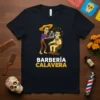 Barberia Calavera T-Shirt with a skeleton barber giving a haircut to another skeleton, Dia de los Muertos theme