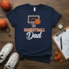 Navy blue t-shirt with "BASKETBALL Dad" text and basketball hoop graphic