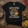 Battle Tested Fiesta Approved t-shirt design featuring a Mexican man with a gun and taco, wearing a sombrero