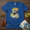 BE Happy French Bulldog wearing a sunflower crown, surrounded by sunflowers and watercolor splashes, on a royal blue t-shirt