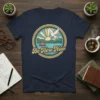 Be Here Now t-shirt with dove flying over a lake and sunset, promoting mindfulness