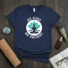 Navy blue t-shirt with white text "BE KIND BE PATIENT" around a green lotus flower and meditating silhouette