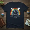 Be Kind t-shirt with rainbow, peace doves, and clasped hands design