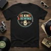 Retro "BE KIND & REWIND" text with a hand graphic and equalizer bars on a black t-shirt