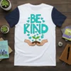 Be Kind quote with a sprout growing in hands, surrounded by hearts, on a white t-shirt with navy sleeves