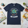 Navy blue t-shirt with "In a world where you can be anything BE KIND" quote and a graphic of the