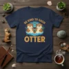 Be Kind To Each Otter t-shirt design with two cute otters in water and green leaves