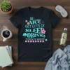 T-shirt with the quote "BE NICE GET LOTS OF SLEEP DRINK PLENTY OF WATER" in decorative turquoise and pink font