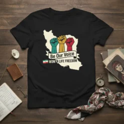 Black t-shirt featuring a map of Iran with three raised fists and the text "Be Our Voice WOMEN LIFE FREEDOM"