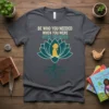 Be Who You Needed When You Were Younger quote t-shirt with lotus and child silhouette design