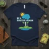 Navy blue t-shirt with "BE A POSITIVE HUMAN" text, a smiling sun, a brain graphic, and a person standing on