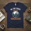 Navy t-shirt with "BE THE VOICE FOR THE VOICELESS" text and a howling wolf in a moonlit forest circle