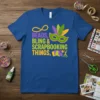 Beads, Bling & Scrapbooking Things quote with Mardi Gras mask and crafting icons on a royal blue t-shirt