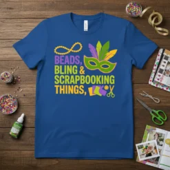 Beads, Bling & Scrapbooking Things quote with Mardi Gras mask and crafting icons on a royal blue t-shirt