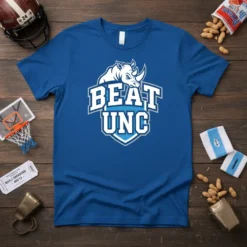 Blue t-shirt featuring the "BEAT UNC" text with a rhinoceros graphic, designed for college sports fans