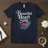 Beautiful Heart and Soul quote on a navy t-shirt with a geometric heart graphic and swirling colorful accents