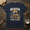 Beaver Nature's Engineer t-shirt featuring a beaver on a log with mountains and trees