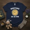 Navy blue t-shirt with white text "BEDTIME IS 10 PM" and a clock graphic showing 10 PM