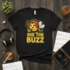 Bee The Buzz t-shirt design featuring a cute cartoon bee wearing headphones and listening to music