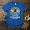 BEES & BLOSSOMS SWEET HARMONY text on a blue t-shirt with a central bee graphic surrounded by floral elements